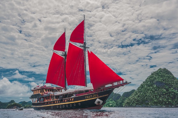 Calico Jack - Yacht Charter Indonesia - Luxury Boat Rental Classic Phinisi Side View Sails